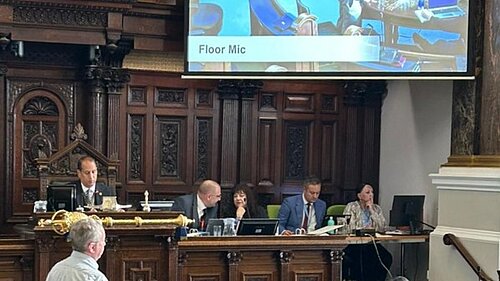 Local Lib Dem Campaigner Philip Mills asking public question pressing Council on effective enforcement of dangerous pavement parking offences